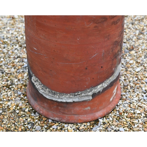 35 - A tall terracotta cylindrical chimney pot, 150 cm high