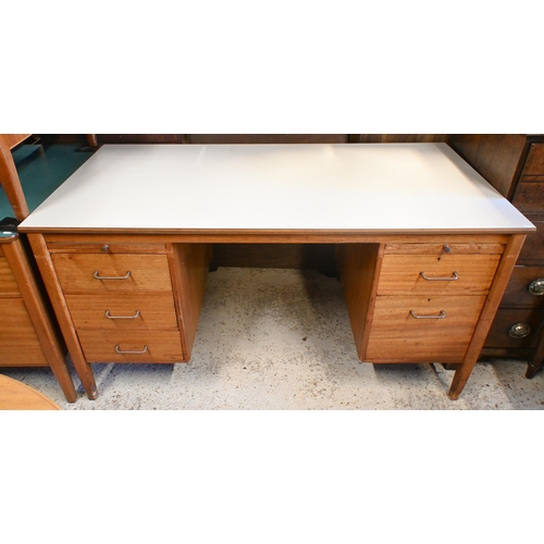 44 - A mid-century grey laminate top ex-ministry kneehole desk, with an arrangement of five drawers and t... 