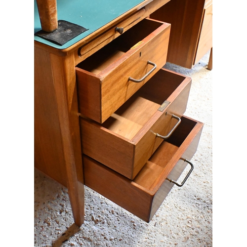 45 - A mid-century green laminate top ex-ministry kneehole desk, with an arrangement of five drawers and ... 