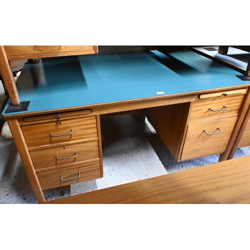 45 - A mid-century green laminate top ex-ministry kneehole desk, with an arrangement of five drawers and ... 