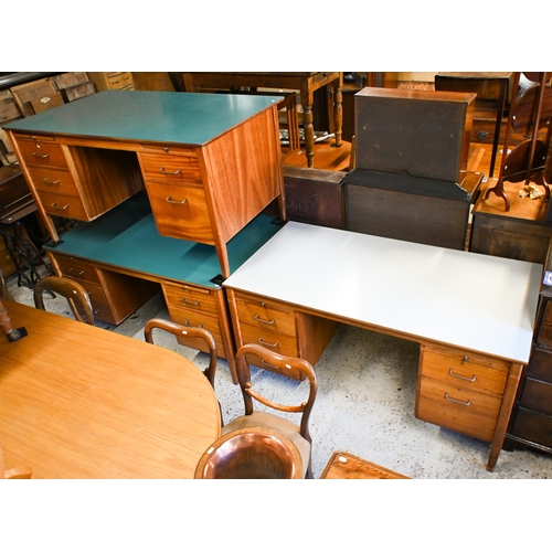 45 - A mid-century green laminate top ex-ministry kneehole desk, with an arrangement of five drawers and ... 