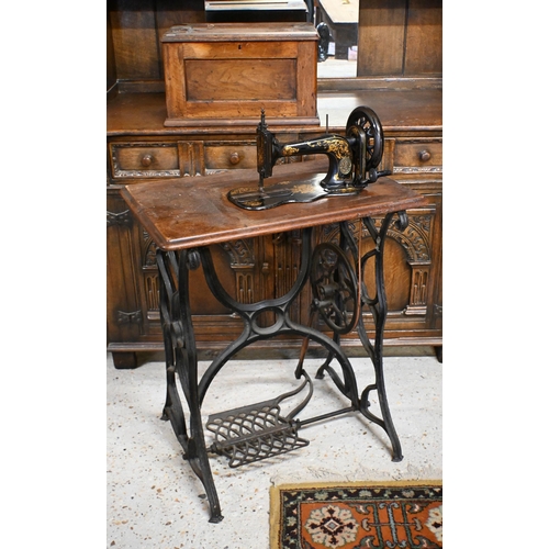 48 - # A vintage Singer treadle sewing machine table with cast iron base and machine box cover, a/f