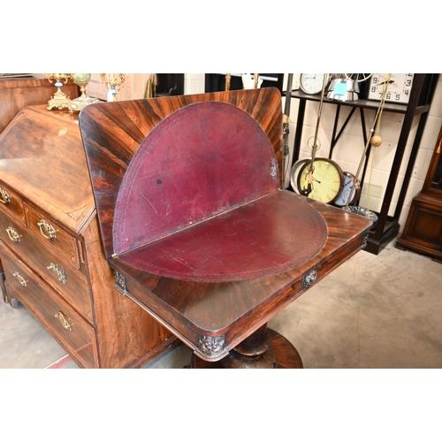 498 - A Regency rosewood card table with rotating folding top, turned column and platform base with lion p... 