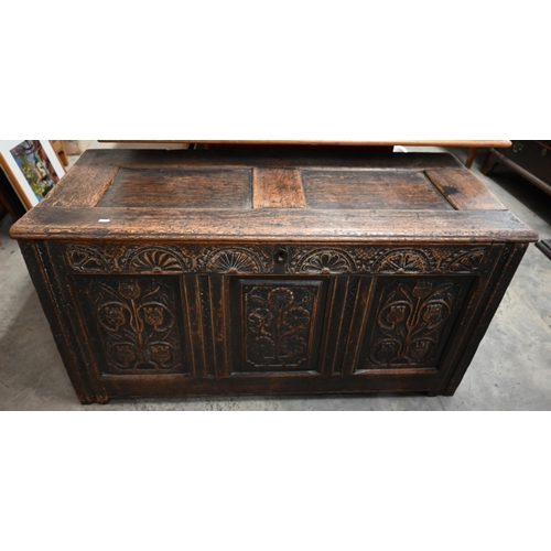 501 - An antique oak coffer, panelled construction, the front carved with thistles, 122 x 52 x 60 cm high,... 