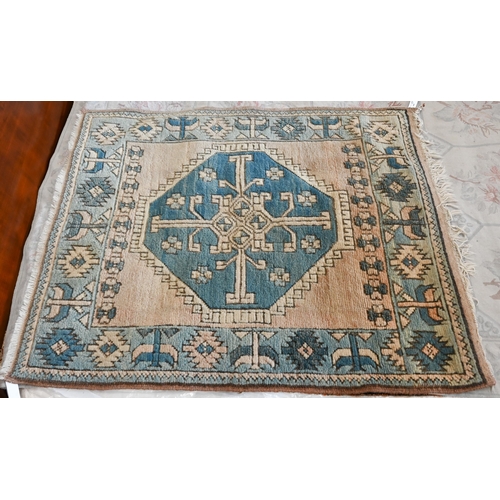 513 - # A faded Aubusson floral rug, 187 cm x 130 cm to/w a Turkish Milas blue and terracotta rug, 124 cm ... 