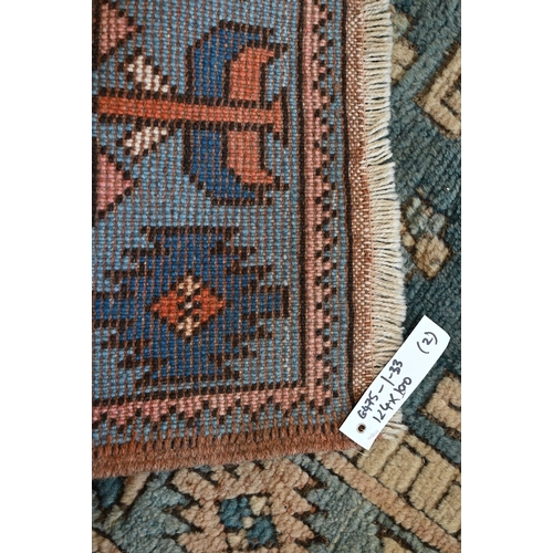 513 - # A faded Aubusson floral rug, 187 cm x 130 cm to/w a Turkish Milas blue and terracotta rug, 124 cm ... 