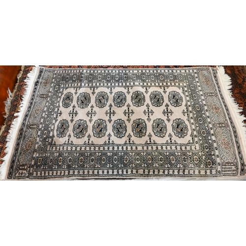 516 - A Pakistani Turkoman design rug, peach ground