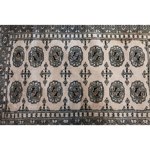 516 - A Pakistani Turkoman design rug, peach ground