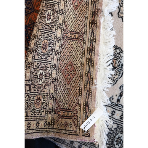 516 - A Pakistani Turkoman design rug, peach ground