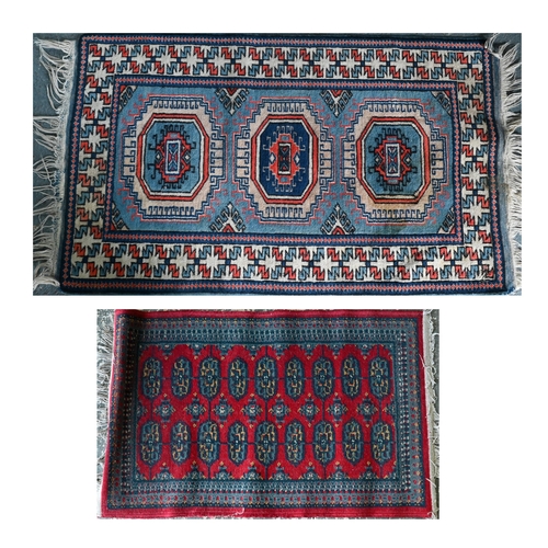 518 - A Turkish geometric design blue ground rug, 110 cm x 59 cm to/w a Pakistan Turkoman design reg groun... 