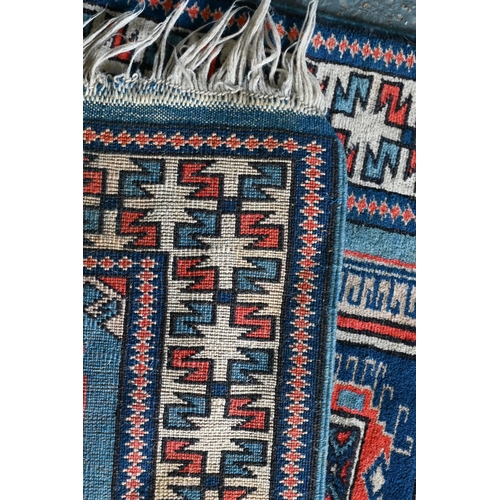 518 - A Turkish geometric design blue ground rug, 110 cm x 59 cm to/w a Pakistan Turkoman design reg groun... 