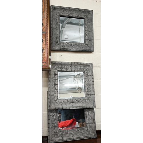 53 - Three wall mirrors, bevelled glass and embossed grey painted metal frames, 69 x 69 cm (3)