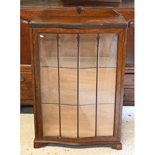 537 - An Arts & Crafts serpentine form glazed display cabinet, 73 cm x 31 cm x 108 cm h