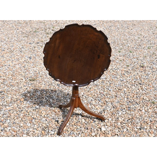 544 - A reproduction piecrust tilt-top tripod table, 52 cm dia. x 61 cm h