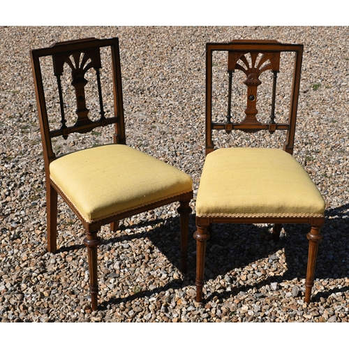 554 - A pair of Victorian aesthetic period walnut and ebonised parcel gilt framed side chairs to/w a count... 