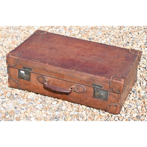 558 - John Pound & Co Ltd, a vintage tan leather suitcase