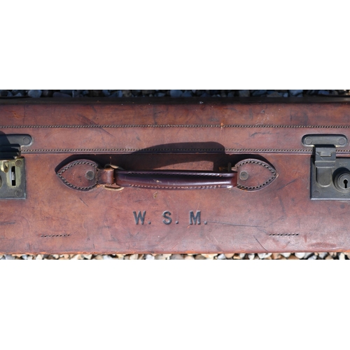 558 - John Pound & Co Ltd, a vintage tan leather suitcase