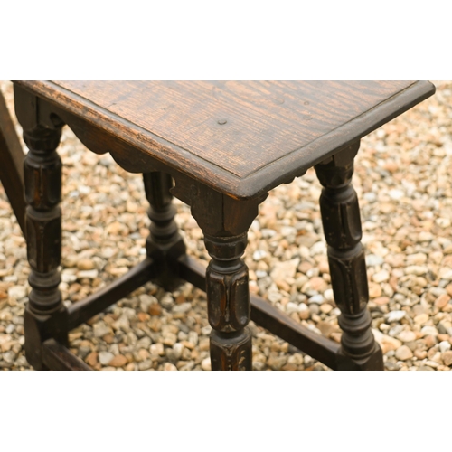 559 - A 17th century style carved oak joint stool to/w an oak two-tier cake stand (2)