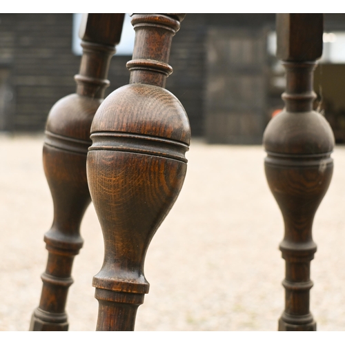 559 - A 17th century style carved oak joint stool to/w an oak two-tier cake stand (2)