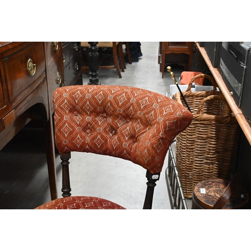 561 - A Victorian walnut framed button back  nursing chair