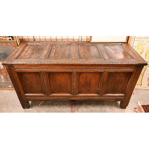 565 - A large antique panelled oak coffer, 144 cm w x 58 cm d x 72 cm h