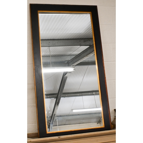 566 - A large modern wall mirror in gilded and painted frame, 150 cm x 80 cm to/w another modern gilt fram... 