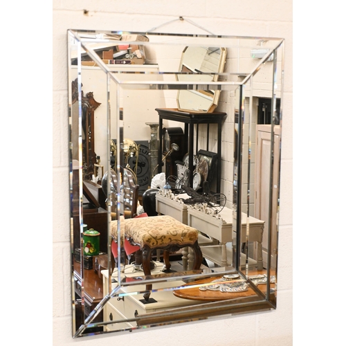 567 - Two contemporary wall mirrors (larger with minor damage) both with bevelled mirror glass surrounds, ... 