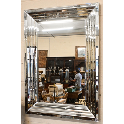 567 - Two contemporary wall mirrors (larger with minor damage) both with bevelled mirror glass surrounds, ... 