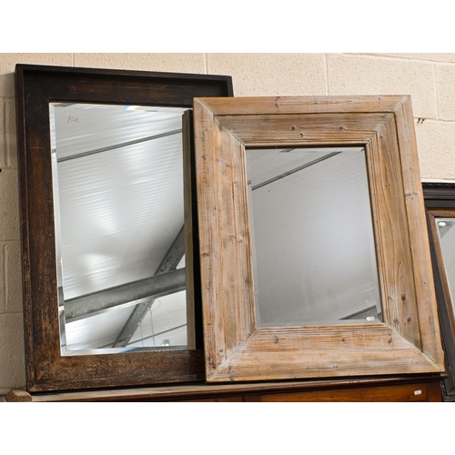 569 - Two bevelled mirrors with limed and stained antiqued frames, 81 cm x 72 cm and 100 cm x 70 cm to/w a... 