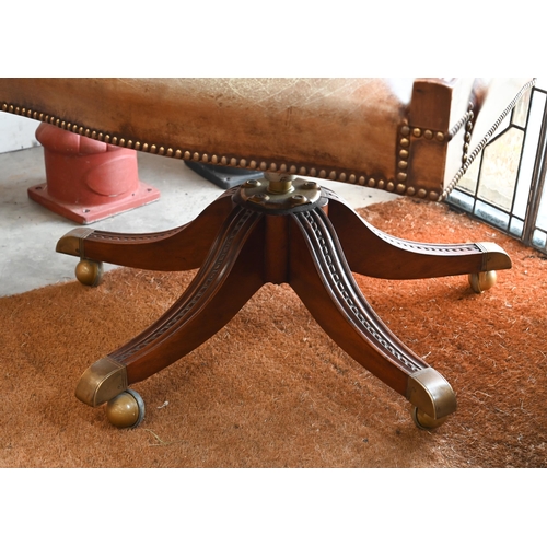 59 - A mahogany framed swivel director's/office chair with studded aged vinyl/leatherette upholstery