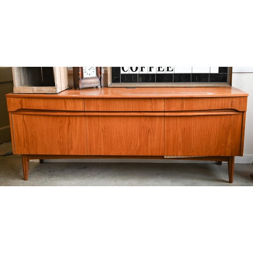 63 - A Mid-Century Remploy teak bowfront sideboard, circa 1960s, central drop front cocktail cabinet betw... 