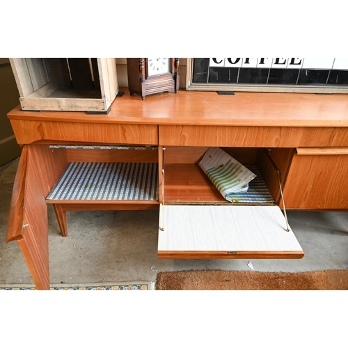 63 - A Mid-Century Remploy teak bowfront sideboard, circa 1960s, central drop front cocktail cabinet betw... 