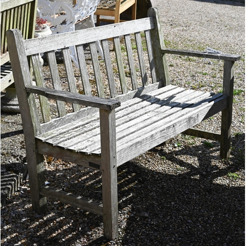 7 - A weathered teak patio dining set comprising dining table on cross-trestle supports, 214 x 108 x 72 ... 