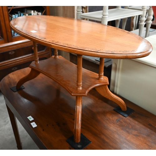 75 - Modern golden oak and burr walnut banded oval coffee table with four turned pillars and quadraform b... 