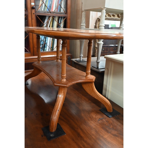 75 - Modern golden oak and burr walnut banded oval coffee table with four turned pillars and quadraform b... 