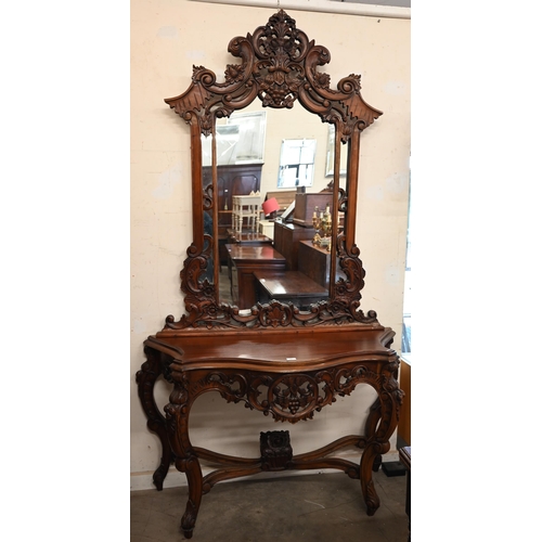 84 - A Rococo style carved hardwood serpentine front console table and mirror, 138 x 50 x 234 cm h