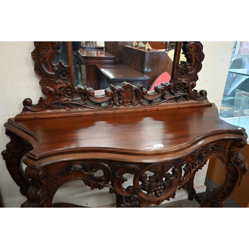 84 - A Rococo style carved hardwood serpentine front console table and mirror, 138 x 50 x 234 cm h