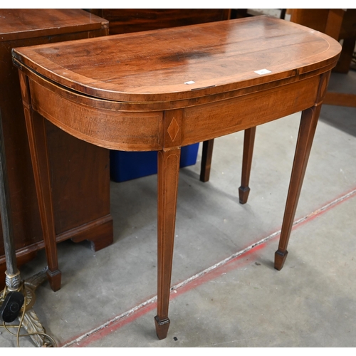 85 - 19th century mahogany demi lune card table with baize lined folding top raised on square tapering su... 