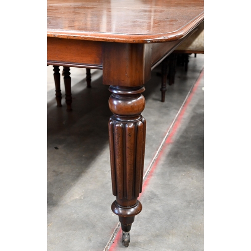 96 - A 19th century mahogany extending dining table, the moulded rectangular top accepting two central le... 