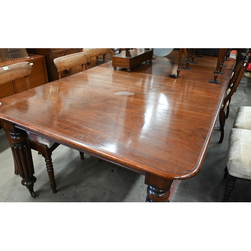 96 - A 19th century mahogany extending dining table, the moulded rectangular top accepting two central le... 