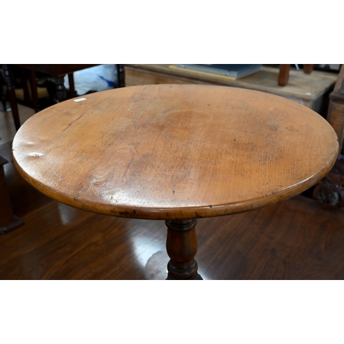 97 - A Provincial 19th century fruitwood circular occasional table with turned column and shaped triform ... 