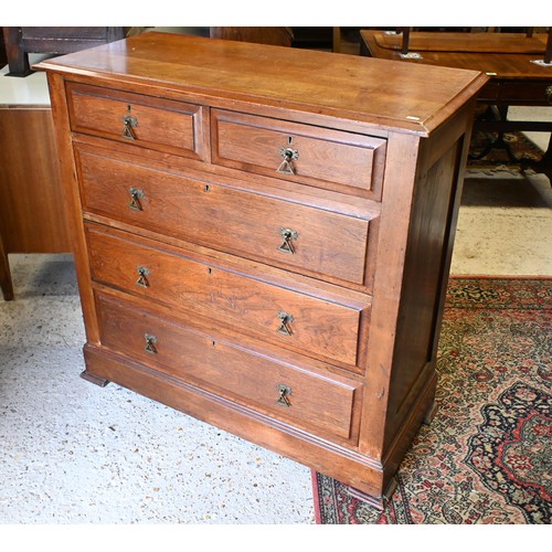 538 - An Arts & Crafts hardwood chest of two short over three long graduated drawers with brass handle... 