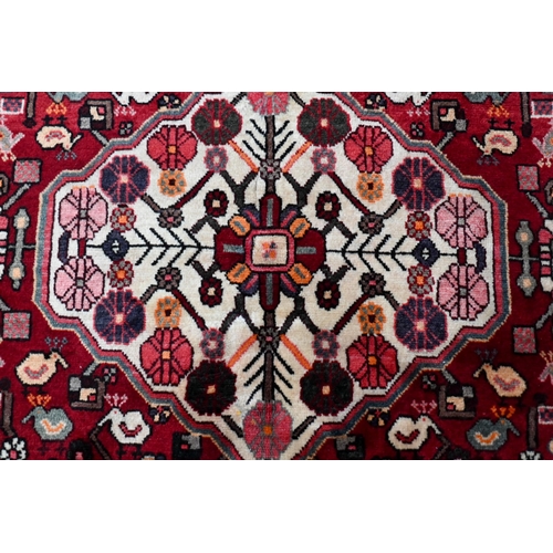 79 - A contemporary central Persian Bakhtiar camel ground rug, 203 cm x 154 cm