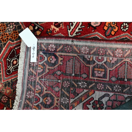 79 - A contemporary central Persian Bakhtiar camel ground rug, 203 cm x 154 cm