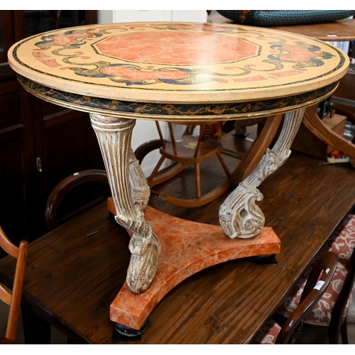 82 - A continental circular centre table with polychrome laminated top on three shaped aged gilt supports... 