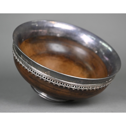 62 - Omar Ramsden: a silver-mounted turned maple wood mazer bowl, the flaring silver rim applied with ban... 