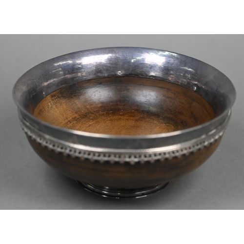 62 - Omar Ramsden: a silver-mounted turned maple wood mazer bowl, the flaring silver rim applied with ban... 