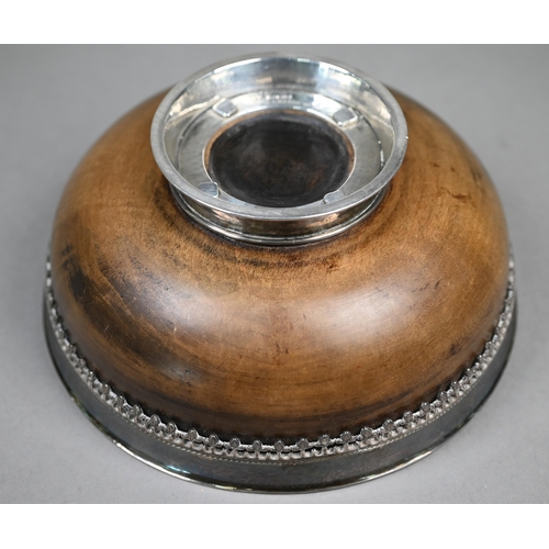 62 - Omar Ramsden: a silver-mounted turned maple wood mazer bowl, the flaring silver rim applied with ban... 