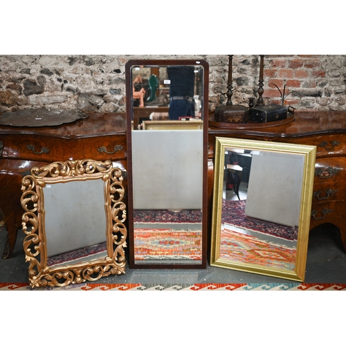 109 - An Edwardian Sheraton Revival walnut framed mirror 137 x 51 cm; two gilt framed mirror and a white-p... 