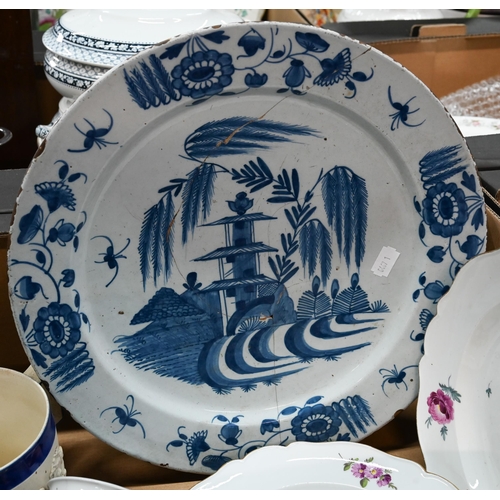 418 - An 18th century Delft charger painted with pagoda within floral border, 34 cm (repaired) to/w a pair... 